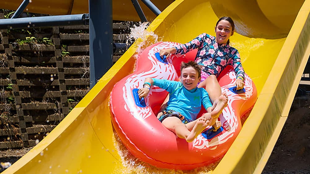 Kids on a waterslide at a DiaBuddies event