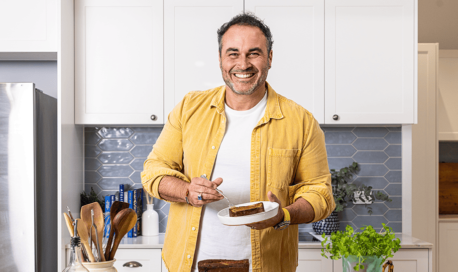 Smiling Miguel Maestre in yellow shirt