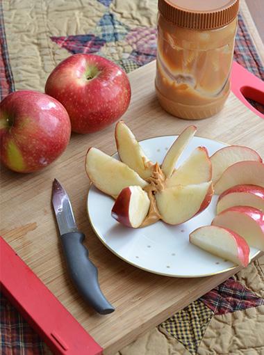 Apple Slices with Almond butter on a plate
