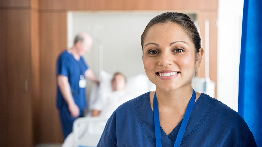 smiley nurse in hospital ward