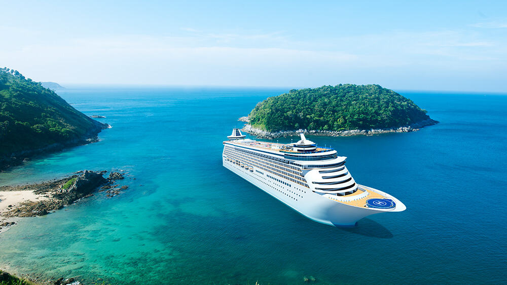 cruise ship near tropical island