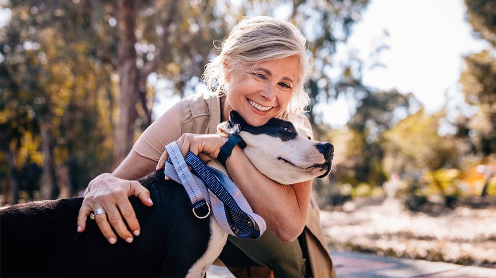 woman hugging dog