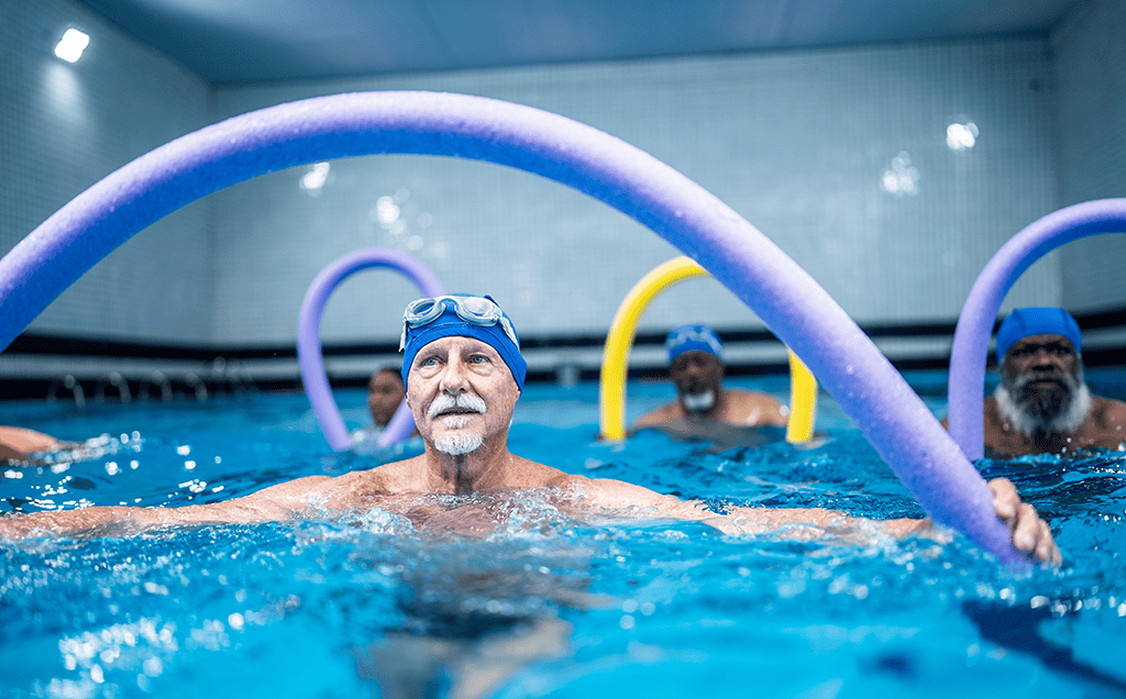 men in pool doing aqua aerobics