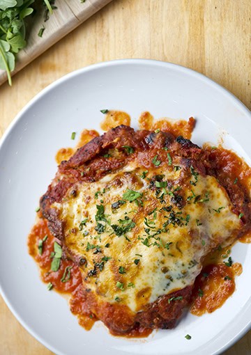 Chicken parmigiana on plate