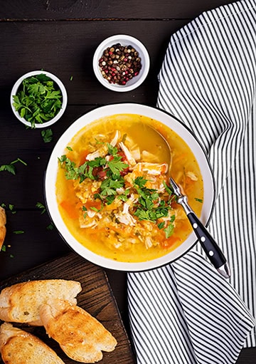 Chicken and vegetable soup in bowl