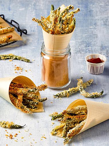 Green Bean Fries wrapped up in paper and in a jar with tomato sauce on the side