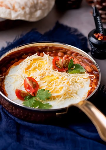 Eggs and beans breakfast in pan