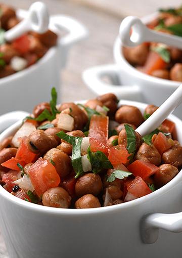 faba bean salad in a white bowl