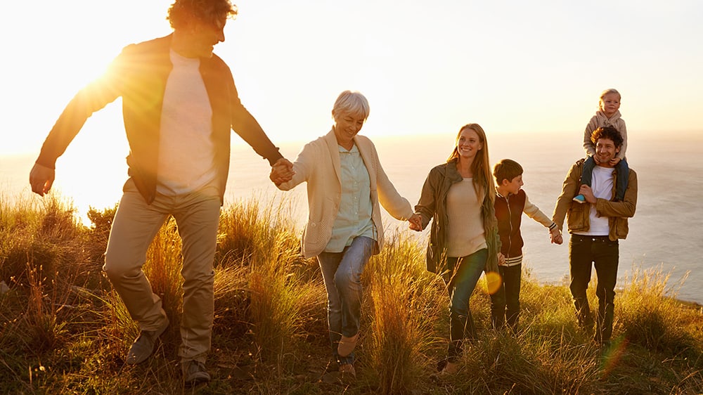 Family walking sunset