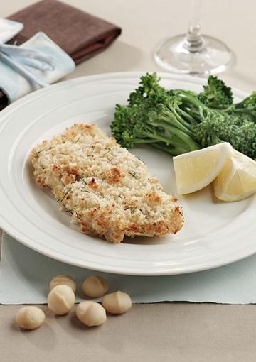 Fish with broccolini and lemon wedges