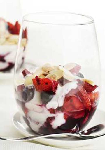 yoghurt compote with berries topped with flaked almonds