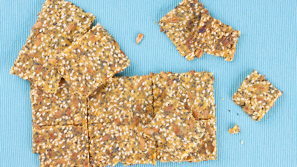 seeded crackers on a blue background