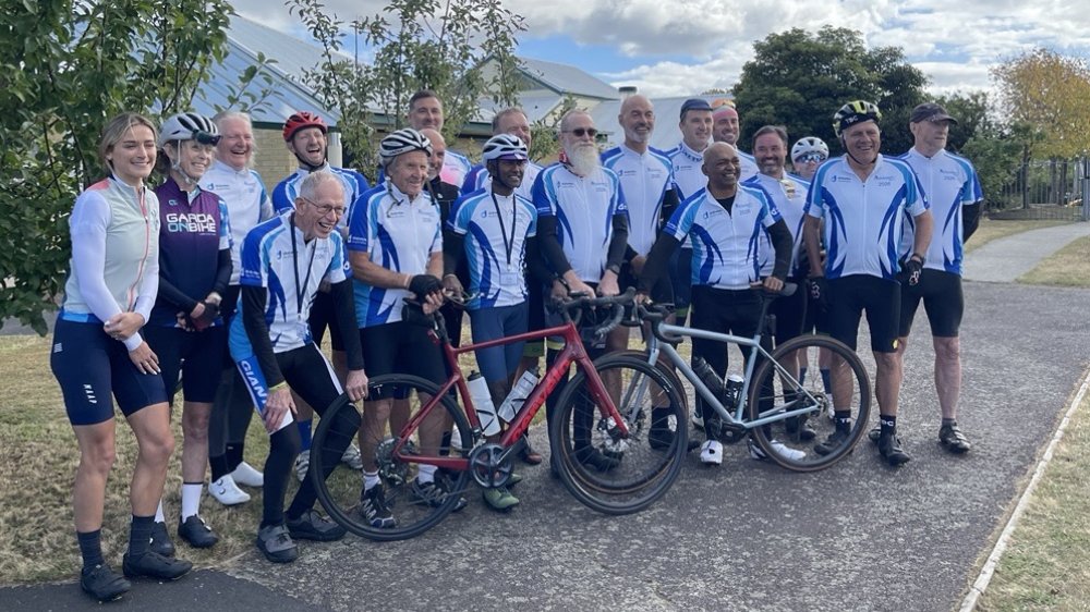 Riders on the 19th PolliePedal (2026) during a stop to discuss living with diabetes.
