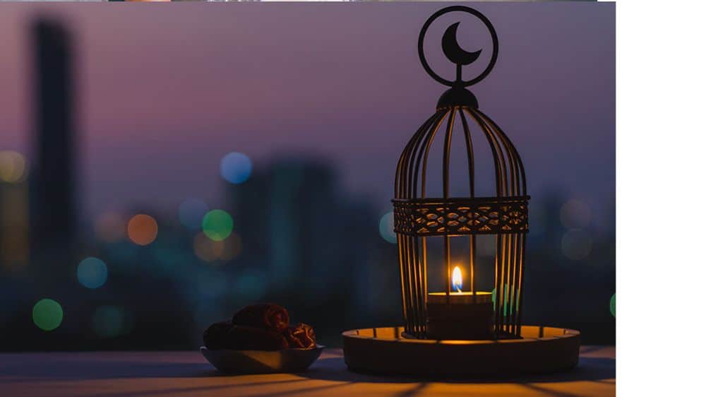 Lantern at dusk with cityscape behind