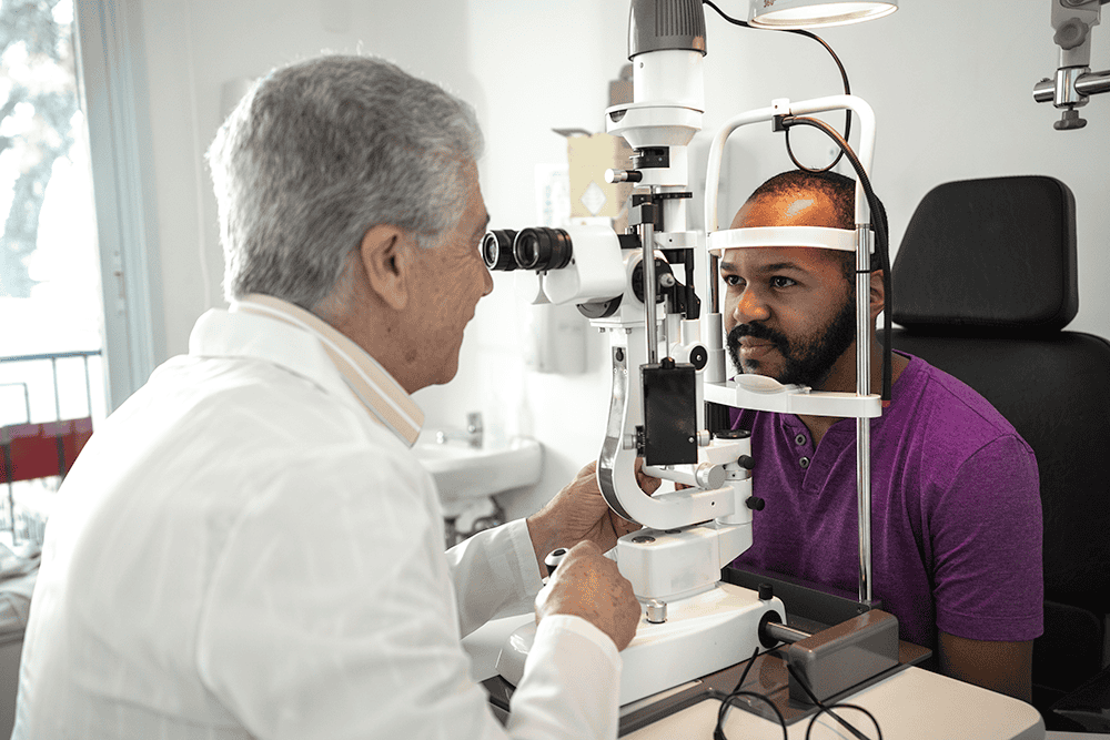 Man having eyes assessed at optician