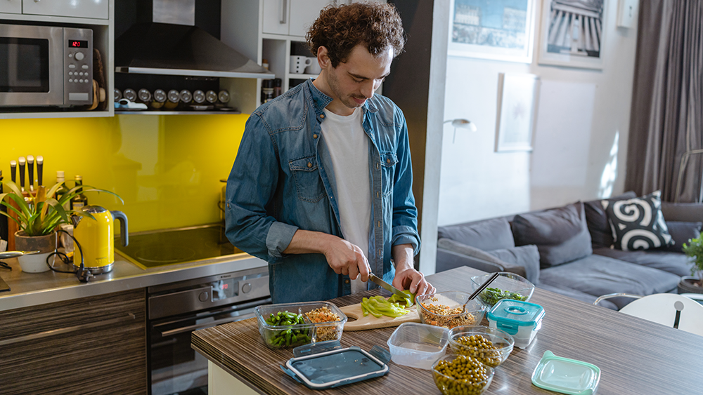 Man making packed lunch at home
