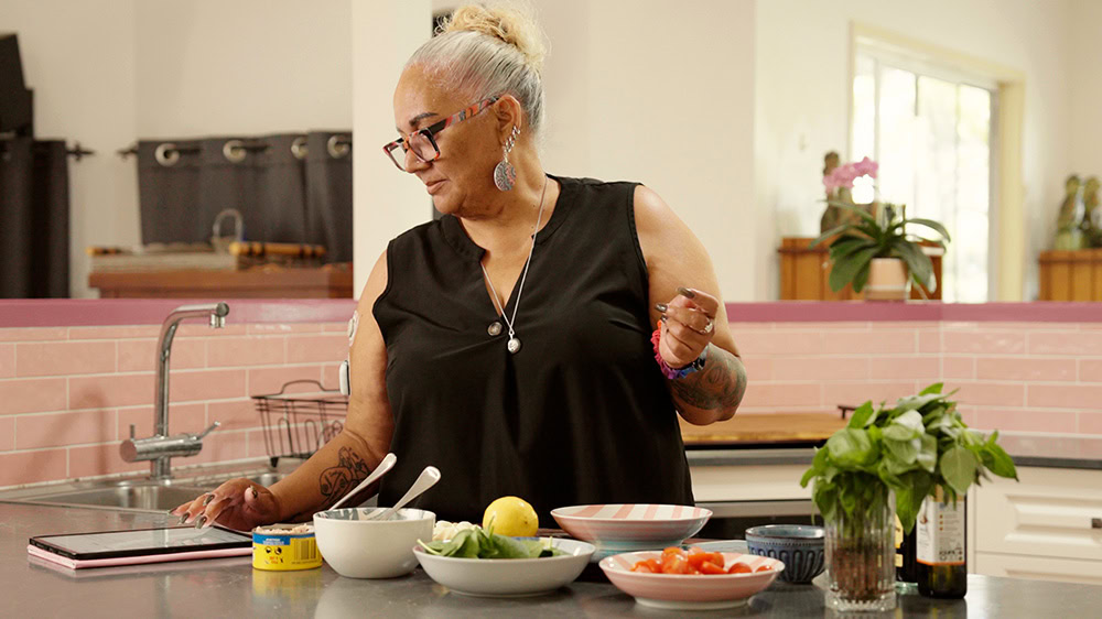Woman cooking a healthy meal in her kitchen 