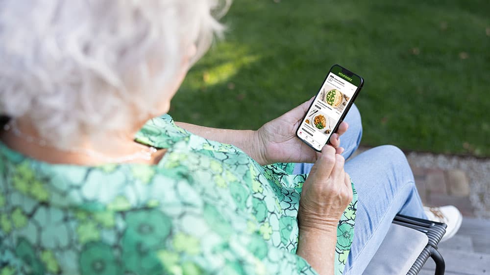 Woman using smartphone outdoors 