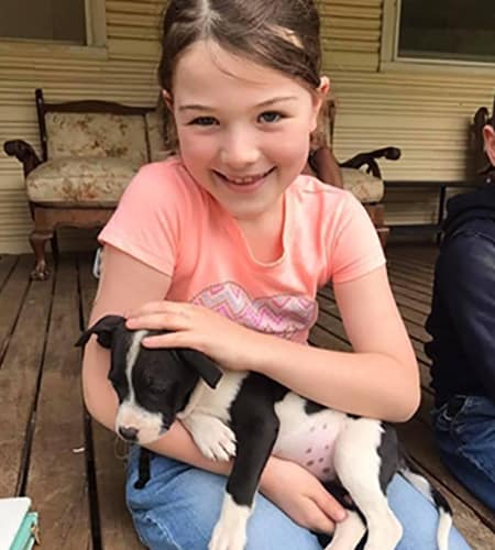 Molly holding a puppy