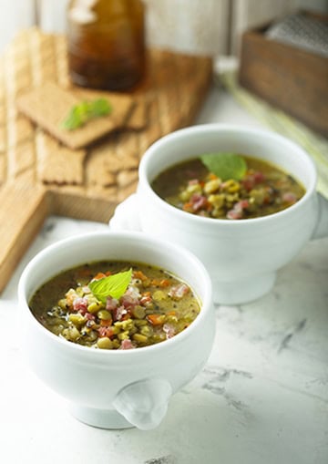 Pea and ham soup in bowl