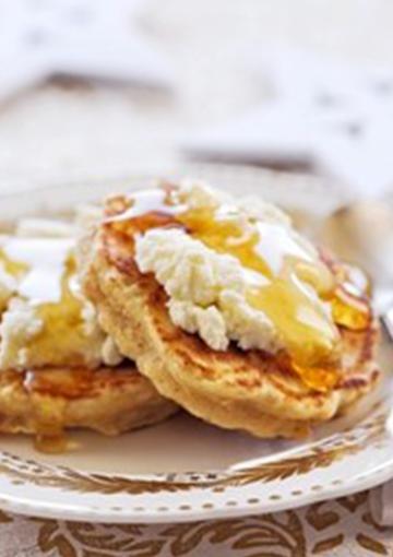 Apricot pikelets topped with cream cheese and honey