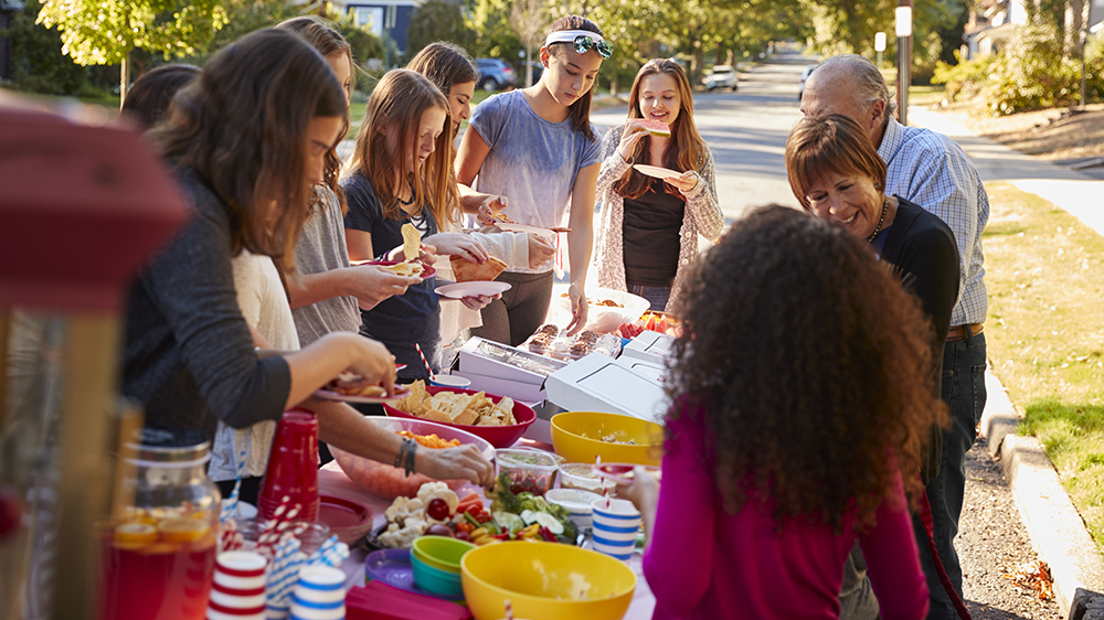 People of various ages enjoying a party outside