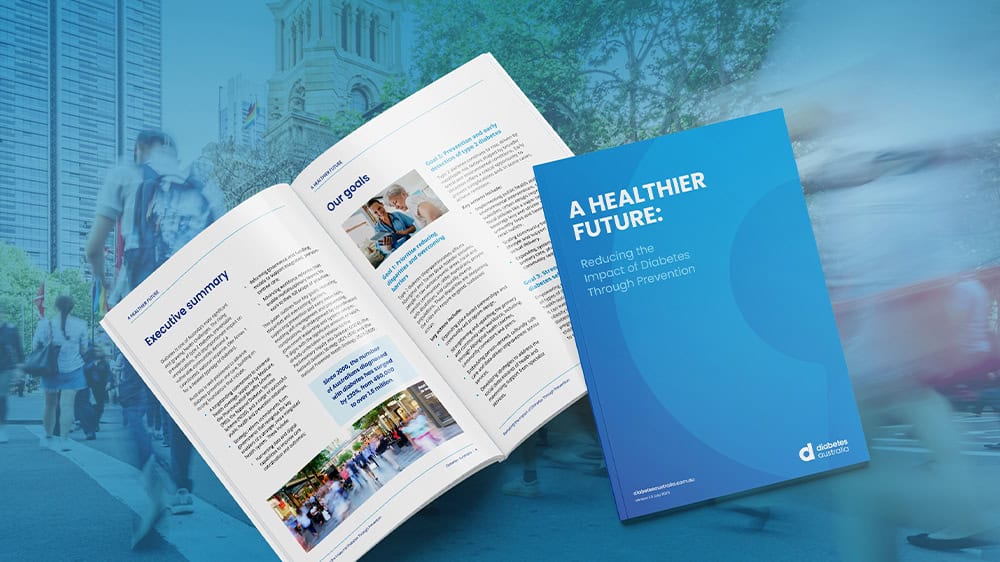 DA's Prevention Policy's cover and an open copy on a blue background.