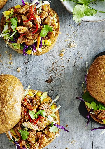 pork burgers with chilli, corn, capcsicum topped with coriander on wholemeal bread rolls