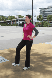 woman standing with one foot off ground