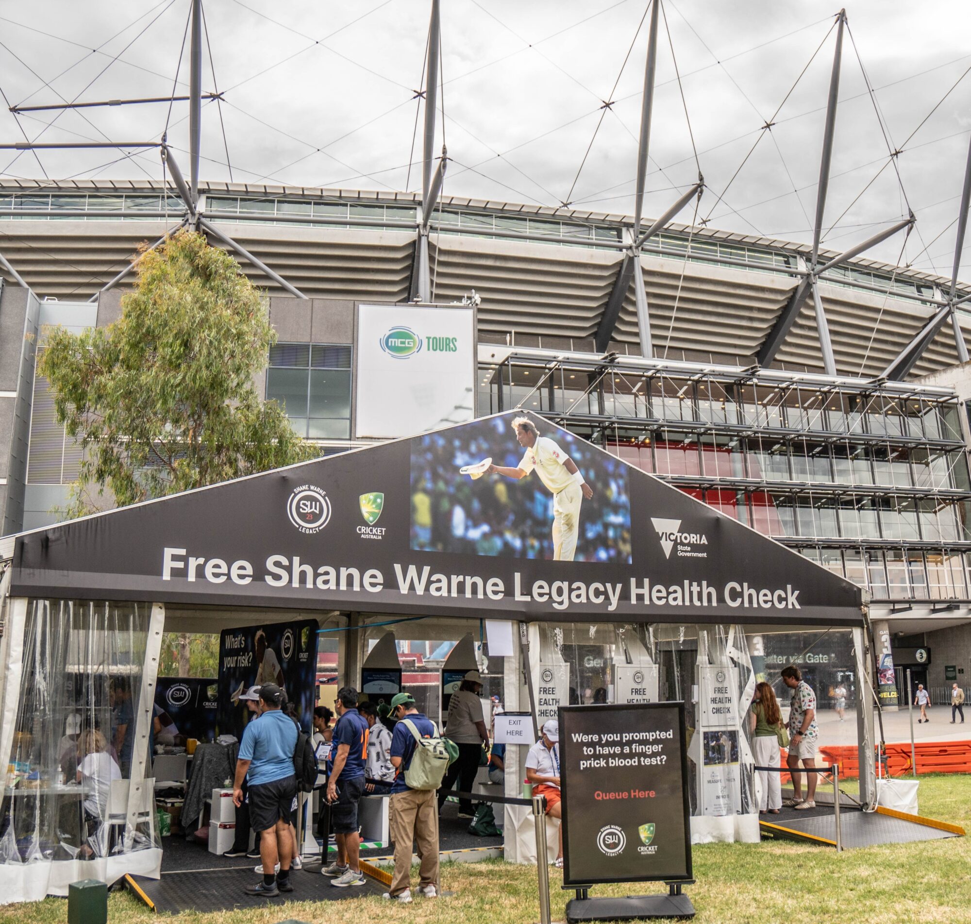 Shane Warne Legacy health check station in front of the Melbourne Cricket Ground