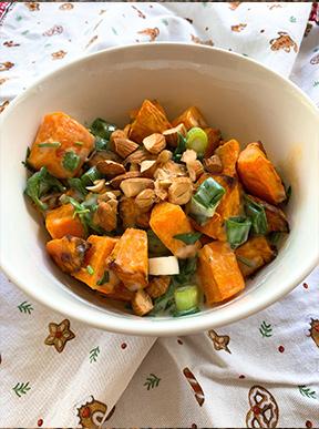 Sweet Potato Salad garnished with almonds and spring onion