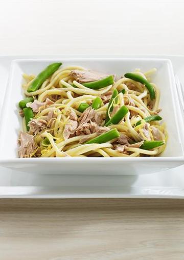 Tuna and Lemon Pasta with green beans on a white serving dish