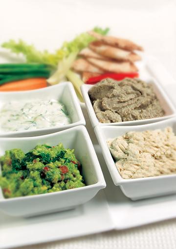 white bean pate tzatziki and other dips in serving dishes