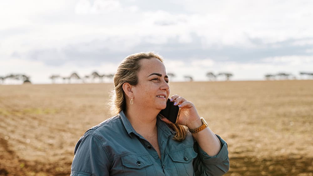 Woman outdoors talking on a phone