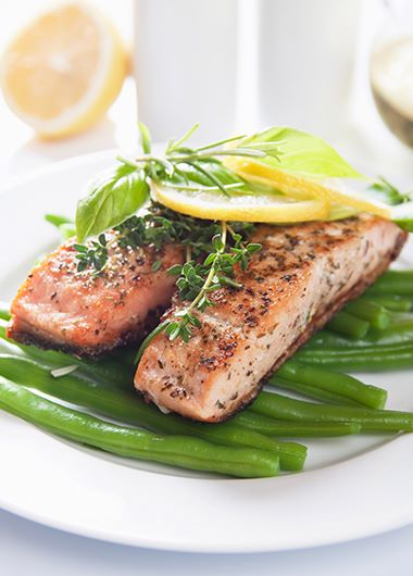 Baked salmon and beans on a plate