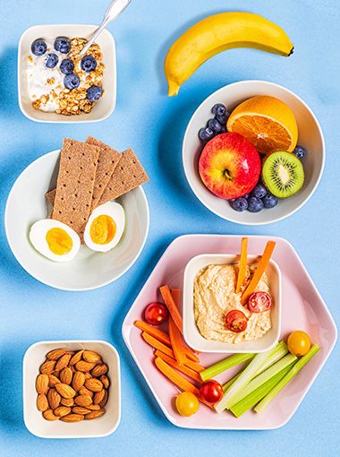 Range of healthy foods arranged on plates