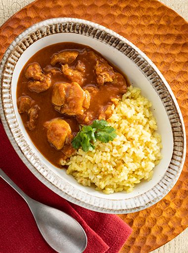 Butter-less chicken and cauliflower rice in a plate, ready to serve