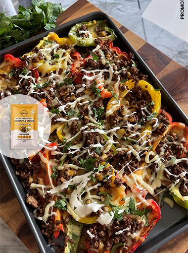 Baking tray of loaded nachos, ready to eat