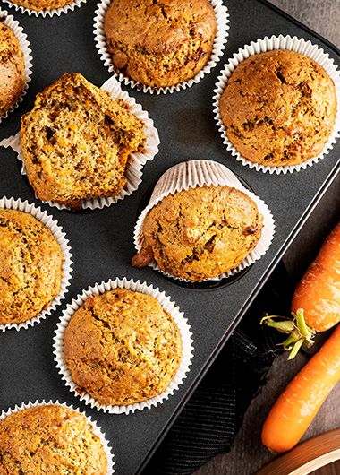 Carrot cake muffins sitting in a tin
