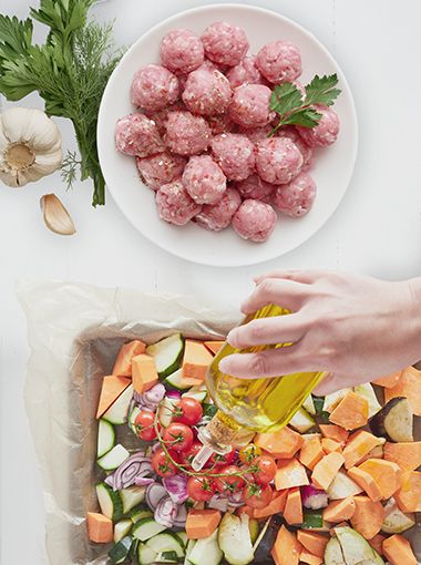 Chicken and feta meatballs being made in a kitchen