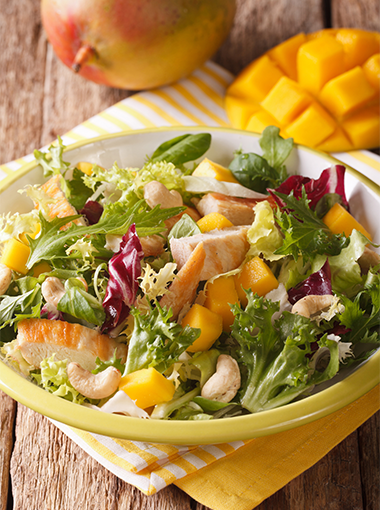 Chicken, mango and mint salad in a bowl