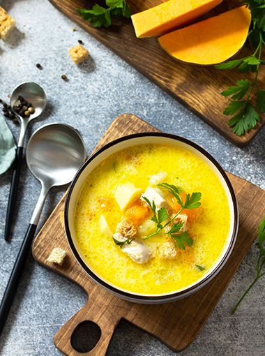 Chicken and pumpkin soup in a bowl, ready to eat