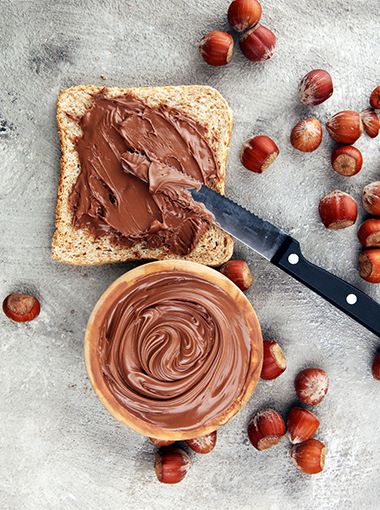 Chocolate spread on toast, ready to be eaten