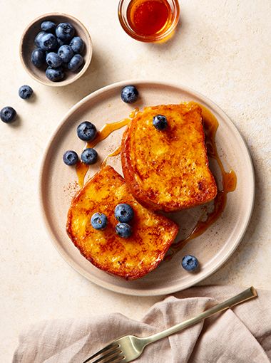 Cinnamon French toast on a plate, with blueberries