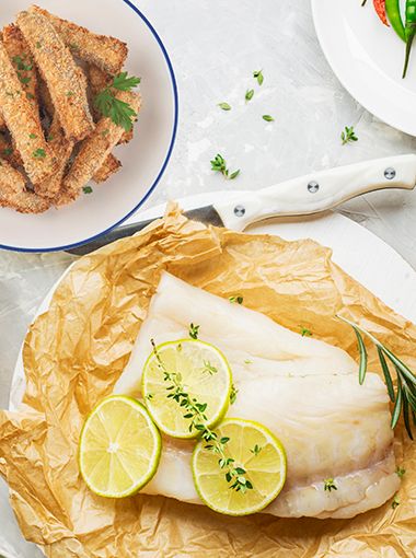 Fish and chips resting on plates