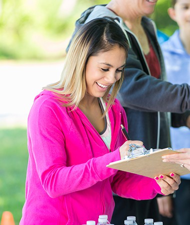 Woman signing up to volunteer