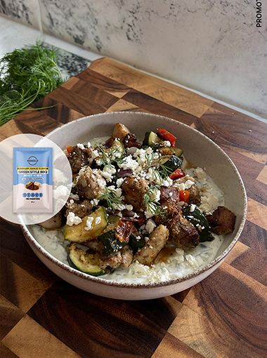 Greek chicken tray bake with rice in a bowl, with Mingle overlay