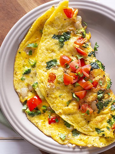 Homemade Vegetable Omelet with Tomato, Broccoli, Spinach, Onion and Red Bell Pepper