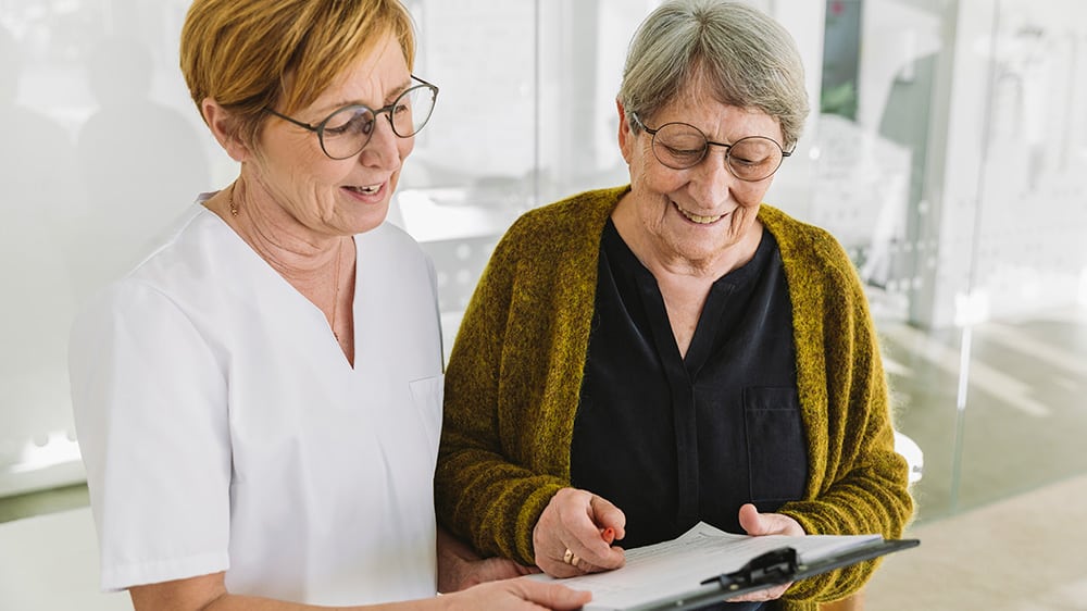 healthcare professional and woman receiving care