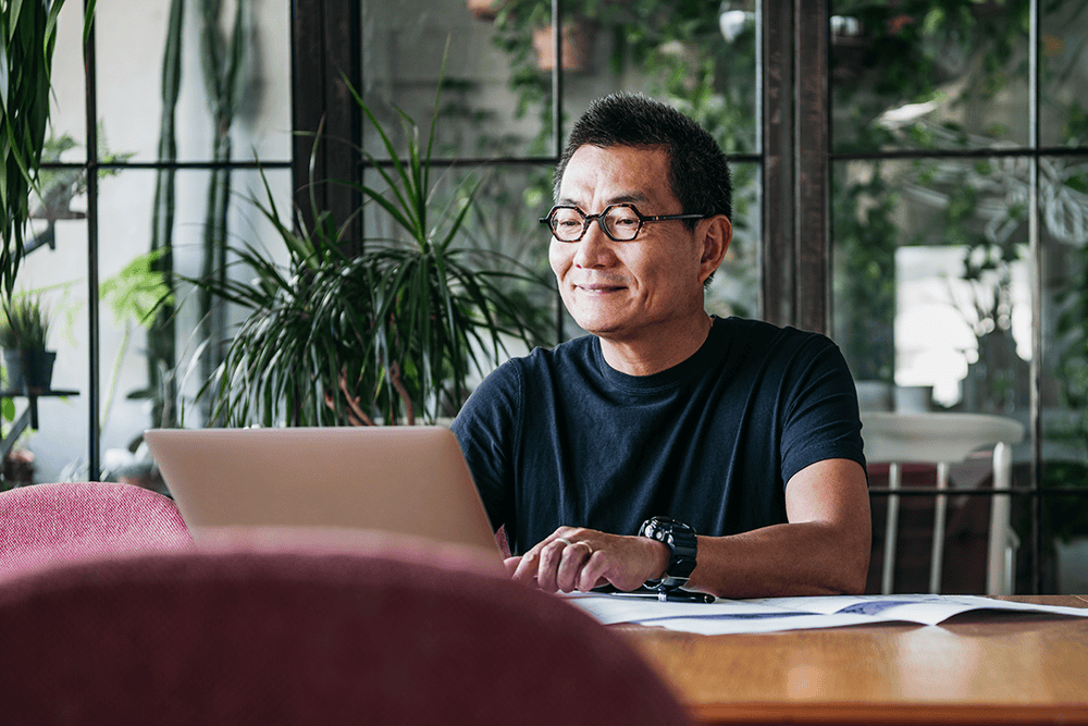 asian man at laptop